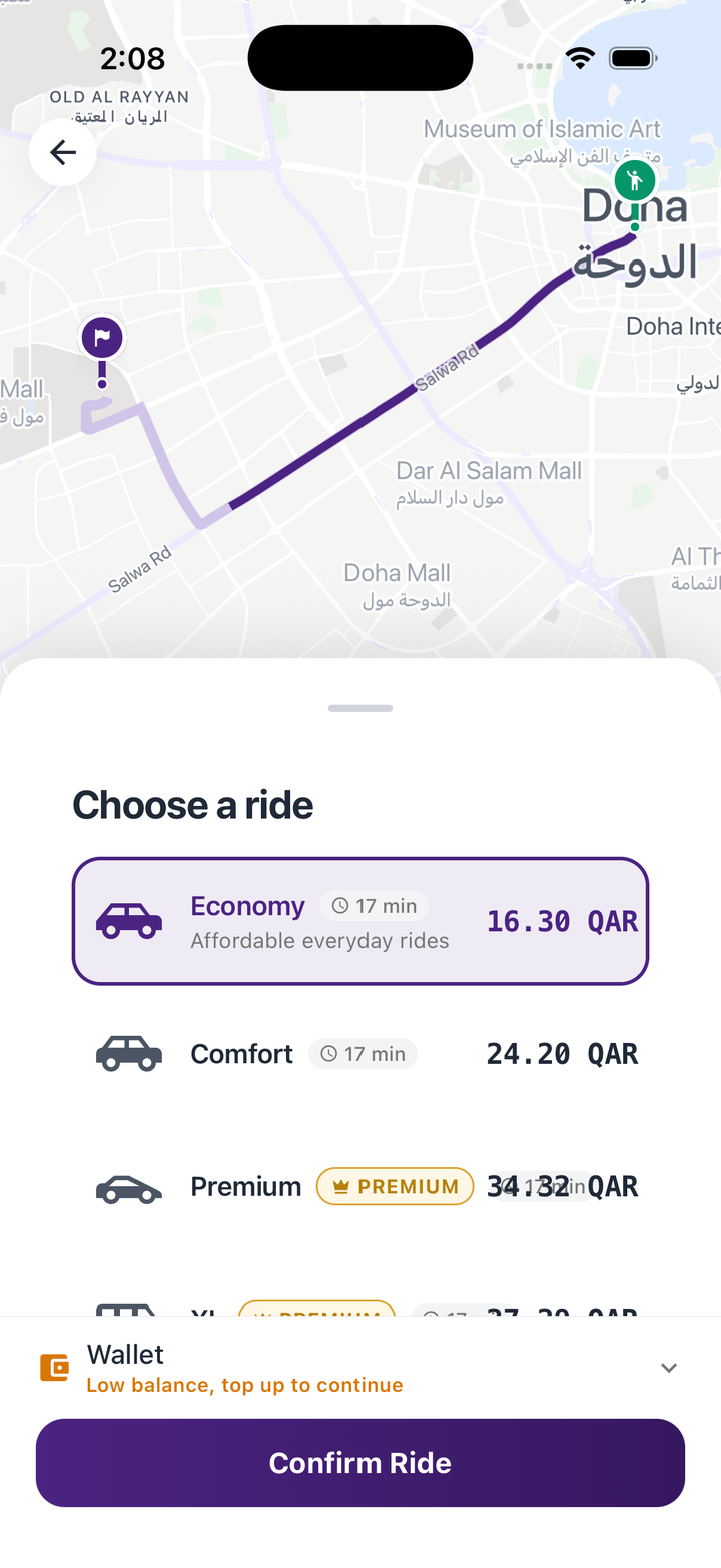 She & She app screen showing a live route on the custom purple-tinted map with ride options and fares in QAR